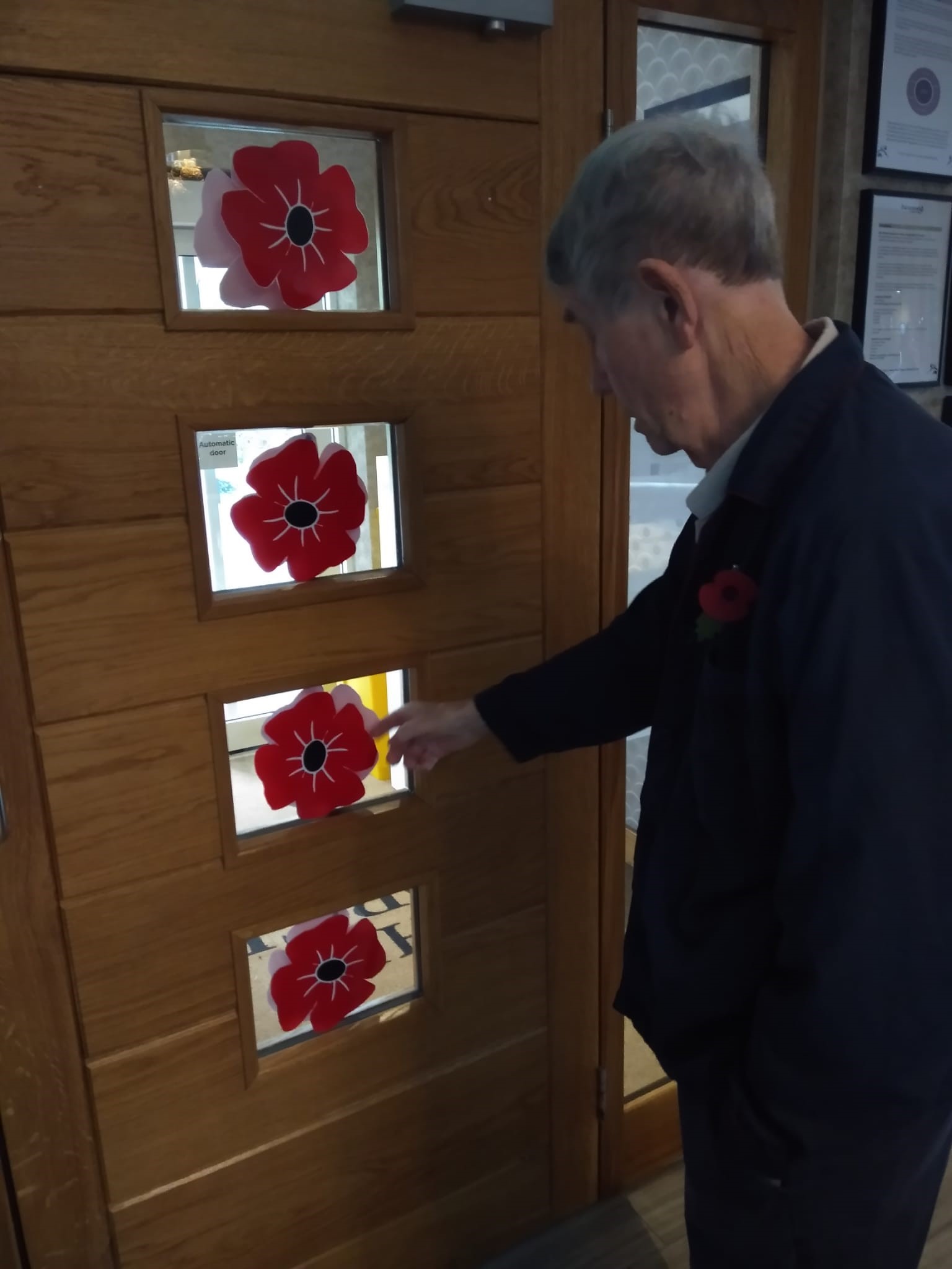 A resident with our decorations to celebrate Armistice Day at The Porterbrook Care Home