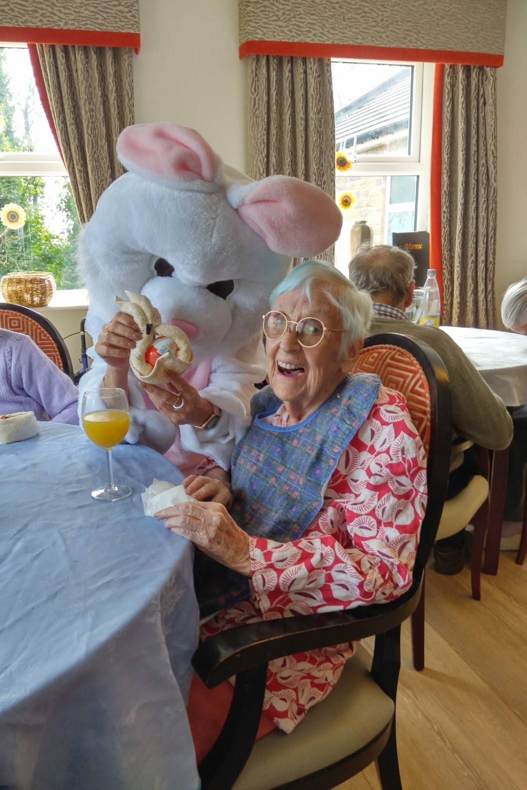 A resident with an Easter bunny mascot at our Easter celebrations at The Porterbrook Care Home