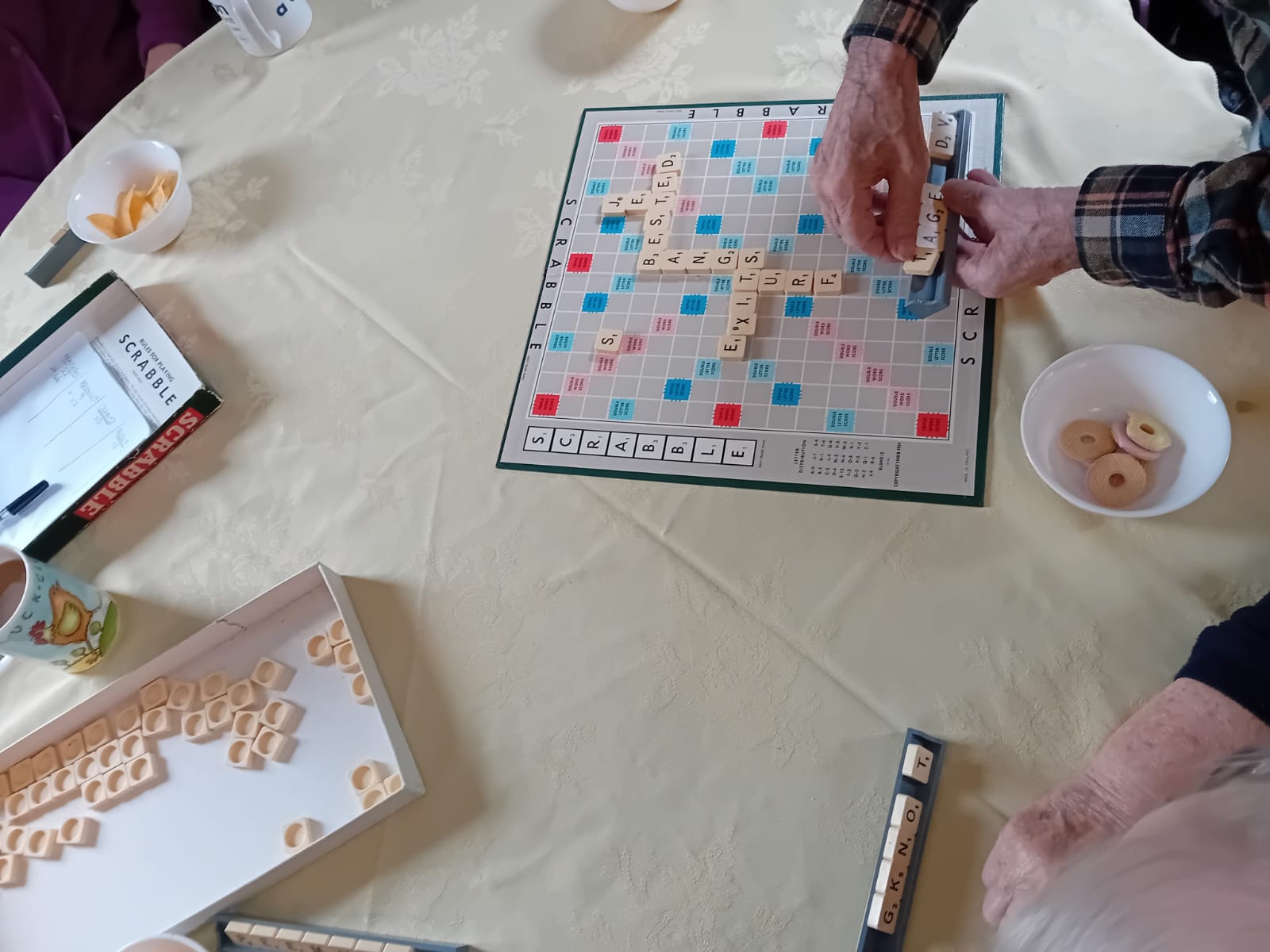 Residents playing Scrabble board game