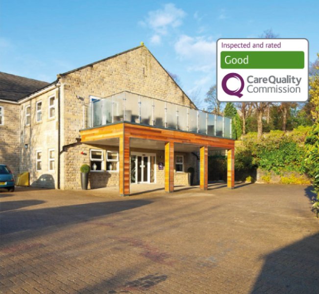 A care home building displaying a 'CQC Good' label