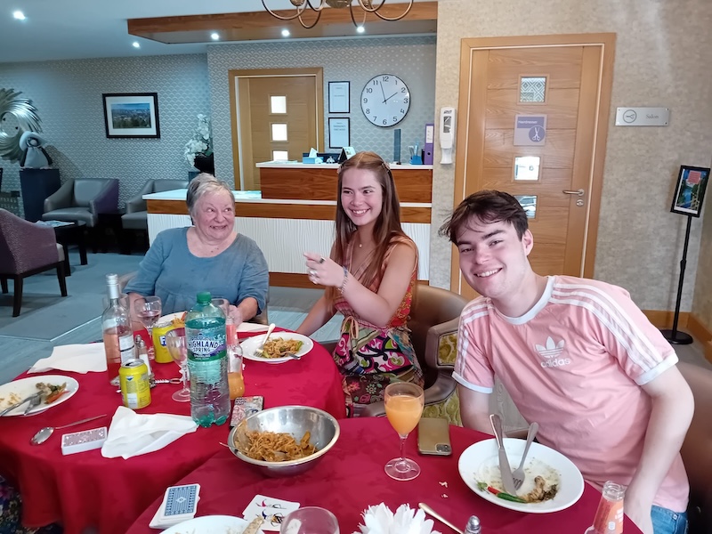 residents' loved ones enjoying dinner with them in the bar area