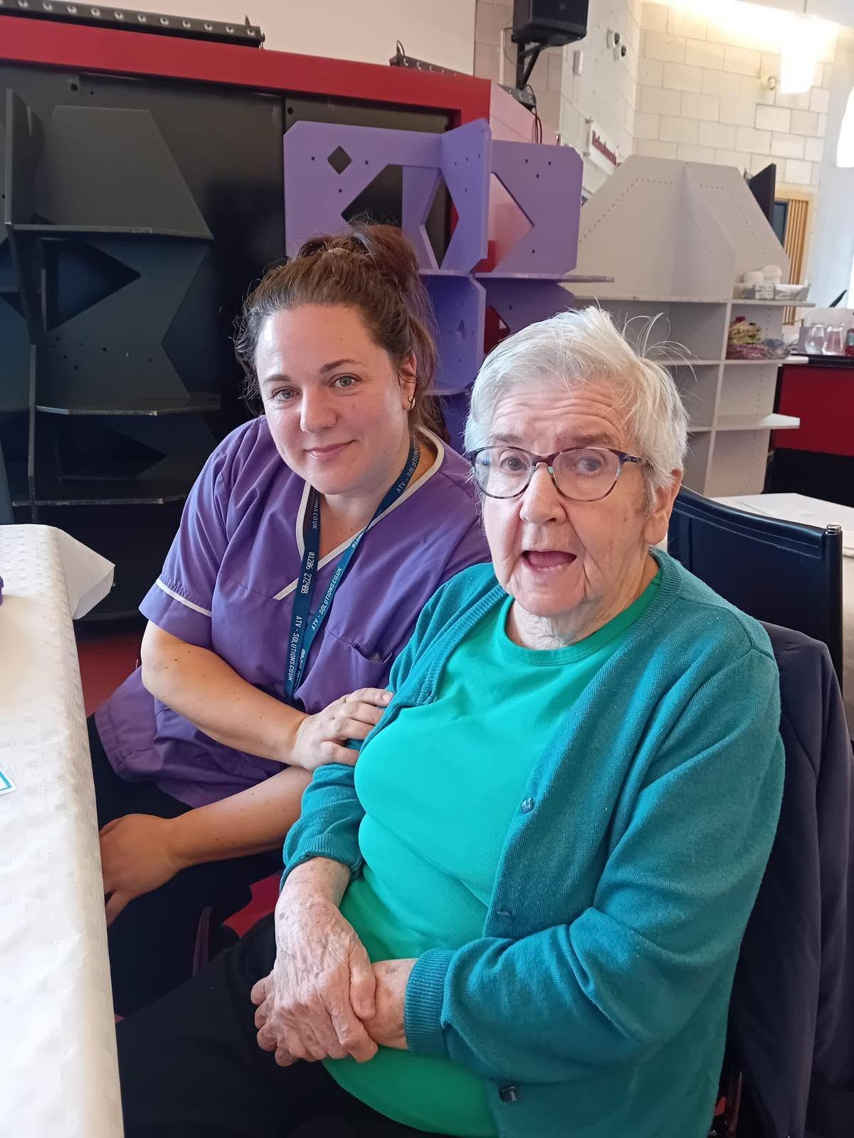 an older lady with a carer